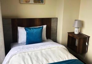 Postel nebo postele na pokoji v ubytování Hotel Suites La Fontana