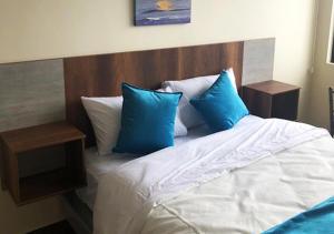 Postel nebo postele na pokoji v ubytování Hotel Suites La Fontana