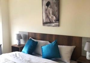 Postel nebo postele na pokoji v ubytování Hotel Suites La Fontana