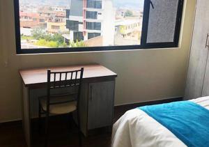 Postel nebo postele na pokoji v ubytování Hotel Suites La Fontana