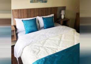 Postel nebo postele na pokoji v ubytování Hotel Suites La Fontana