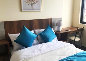 Postel nebo postele na pokoji v ubytování Hotel Suites La Fontana
