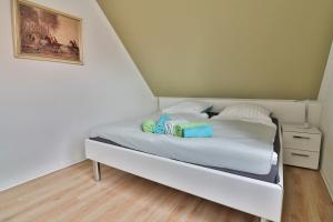 Postel nebo postele na pokoji v ubytování InselReiter - Ferienwohnung WindReiter