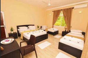 Voodi või voodid majutusasutuse Peacock Resort toas