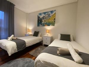 Ένα ή περισσότερα κρεβάτια σε δωμάτιο στο Telletxe Residence +14 φωτογραφίες
