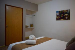 Postel nebo postele na pokoji v ubytování Casa Miranda Morelos