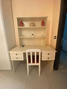 a white desk with a white chair in a room at Vatican Paradise Pisana 43 in Rome