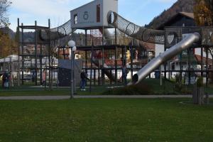 a playground with a slide in a park at Appartement Bergfrieden in Oberstaufen