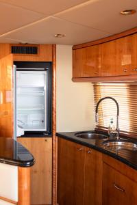 a kitchen with a sink and a window at Luxury Yacht "Amato" in Sanremo