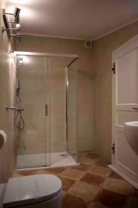 a bathroom with a shower with a toilet and a sink at Pocco Andante in Dubrovnik