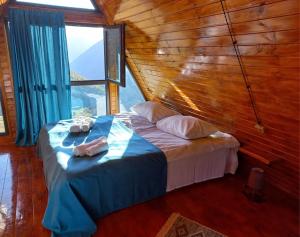 Katil atau katil-katil dalam bilik di Cottage Hillside in Juta