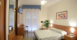 Postel nebo postele na pokoji v ubytování Hotel Bellaria + 19 fotografií