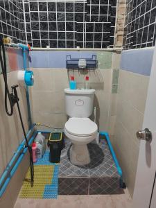 a small bathroom with a toilet in a stall at 108 Quiet and Cozy apartment w/free Wi-Fi in Bangkok