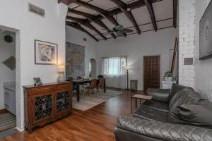 a living room with a couch and a table at Relax with Family at the Beach! in St. Pete Beach