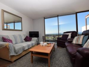 a living room with a couch and a table at 1 bed in Westward Ho 61767 in Westward Ho