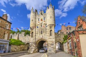 a castle with a car parked in front of it at Spacious Apt in the Heart of York I Pass The Keys in York