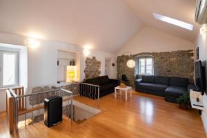 a living room with a couch and a table at Duplex with terrace in the city centar in Split