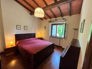 a bedroom with a bed and a large window at Agriturismo La Pineta in Piana +132 photos