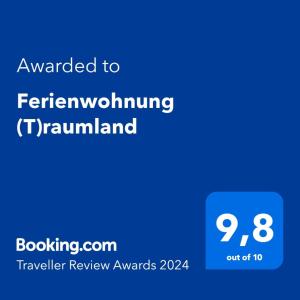 Certifikat, nagrada, logo ili neki drugi dokument izložen u objektu Ferienwohnung (T)raumland