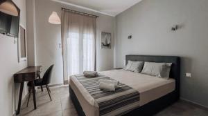 Postel nebo postele na pokoji v ubytování Hotel Eleni