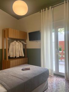 Postel nebo postele na pokoji v ubytování ALPHA HOME SITIA 2