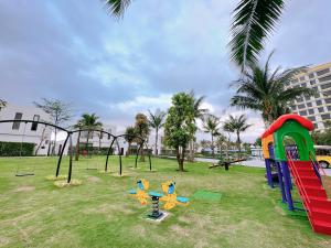 a playground with play equipment in a park at Hoi An Royal Beachfront Resort & Villas in Hà My Tây (2)