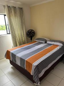 Кровать или кровати в номере Apartamento com vista para o mar