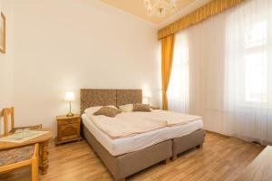 Letto o letti in una camera di Hotel Praga