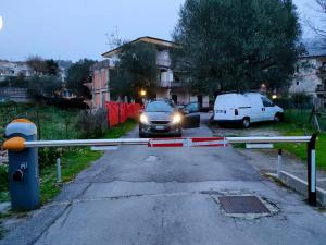 a car with its headlights on is blocking a street at casa vacanze Libeccio parcheggio privato in Sapri