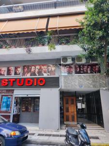 a building with posters of people on the side of it at Relax 5 in Athens