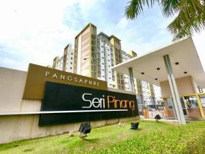 a building with a sign in front of it at setia alam islamic homestay in Shah Alam