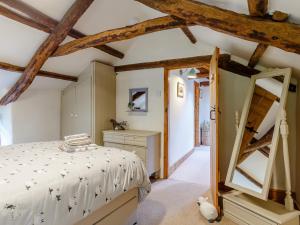 a bedroom with a bed and a wooden ceiling at 3 Bed in Polyphant 78210 in Trewen