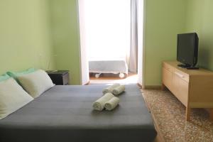 En eller flere senger på et rom på Rome Sleep Home Bed & Breakfast