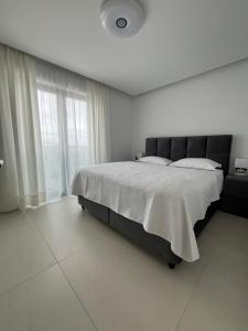 En eller flere senge i et værelse på Primosten Resort Sunhill Deluxe Apartment Maya + 29 billeder