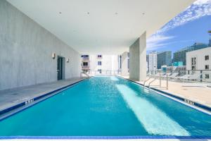 a swimming pool on the roof of a building at Prime location: Luxury Condo at brickell in Miami