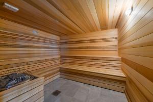 a sauna with wooden paneled walls and a wooden ceiling at Prime location: Luxury Condo at brickell in Miami +21 photos