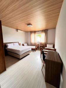 En eller flere senger på et rom på Linda Casa Jardim - 500 Mts da Praia