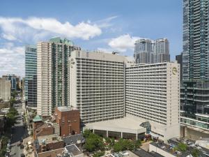 a city with tall buildings and tall buildings at Chelsea Hotel Toronto in Toronto