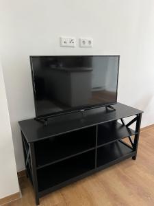 A television and/or entertainment centre at Suite One Langestr II
