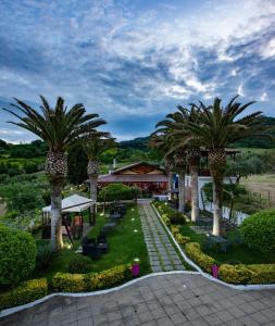 an image of a garden with palm trees at Il Borgo sul Lago in Pizzo