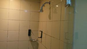 a bathroom with a shower with a glass door at Ruby Star Couples Hostel G P 1&2 in Dubai