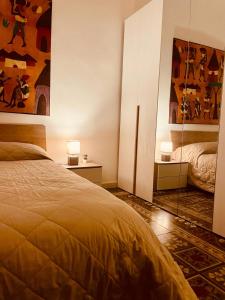 a bedroom with a bed and a mirror at YOUR HOME 26 in Bari
