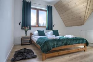 Postel nebo postele na pokoji v ubytování WierchoHouse - domek z jacuzzi