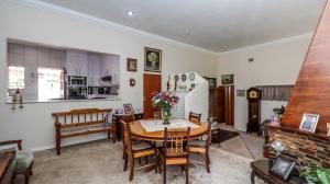 a kitchen and dining room with a table and chairs at BEDFORDVIEW BandB in Bedfordview