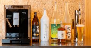 a group of bottles of alcohol on a bar at Relam Glamping Resort Gotemba - Vacation STAY 97812v in Gotemba