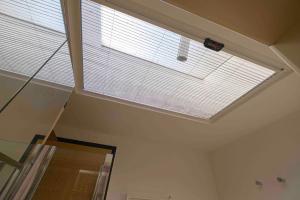 a skylight in the ceiling of a room at Le Petit Prince in Rome +26 photos