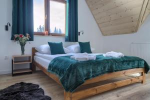 Postel nebo postele na pokoji v ubytování WierchoHouse - domek z jacuzzi