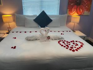 a bed with a bunch of hearts on it at M HOTEL in Miami Beach