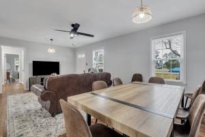 a living room with a table and a couch at Statesboro Sunshine Retreat in Statesboro