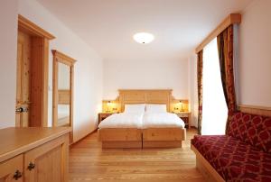 Säng eller sängar i ett rum på Apparthotel Germania
